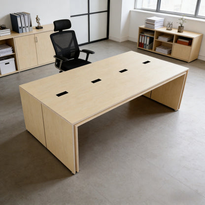 Large wooden desk in an office setting with a chair and shelves.
